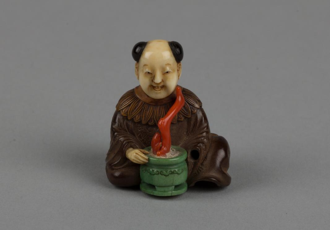 Netsuke of Seated Man with a Flower Pot