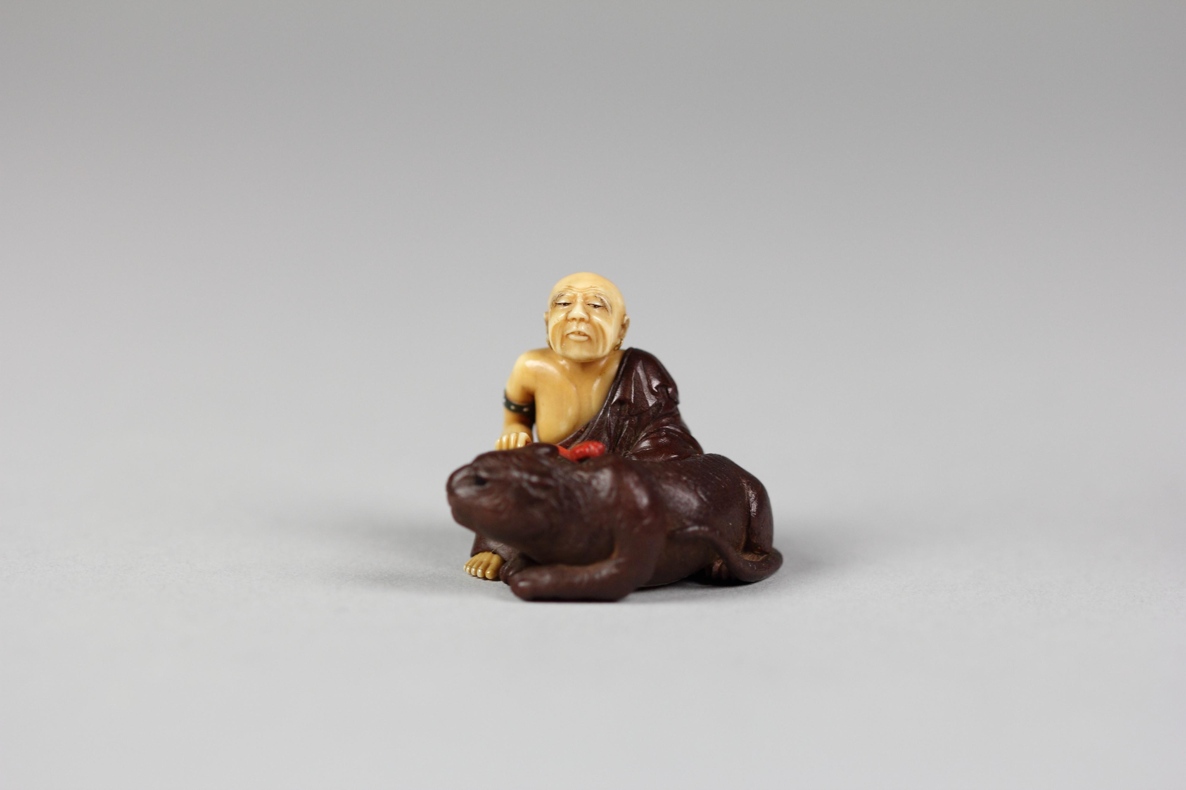 Netsuke of Old Man with a Tiger