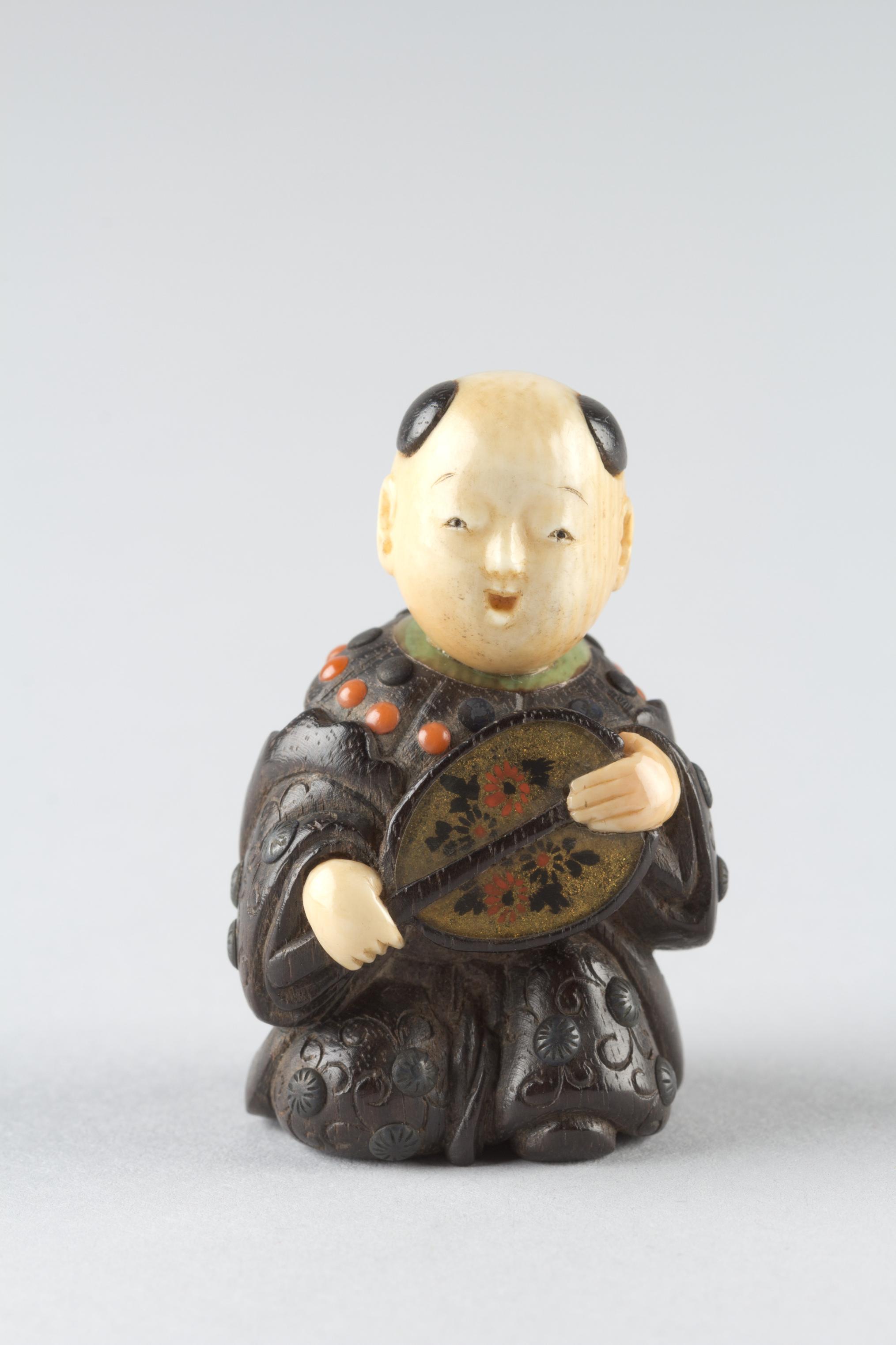 Netsuke of Boy with a Fan
